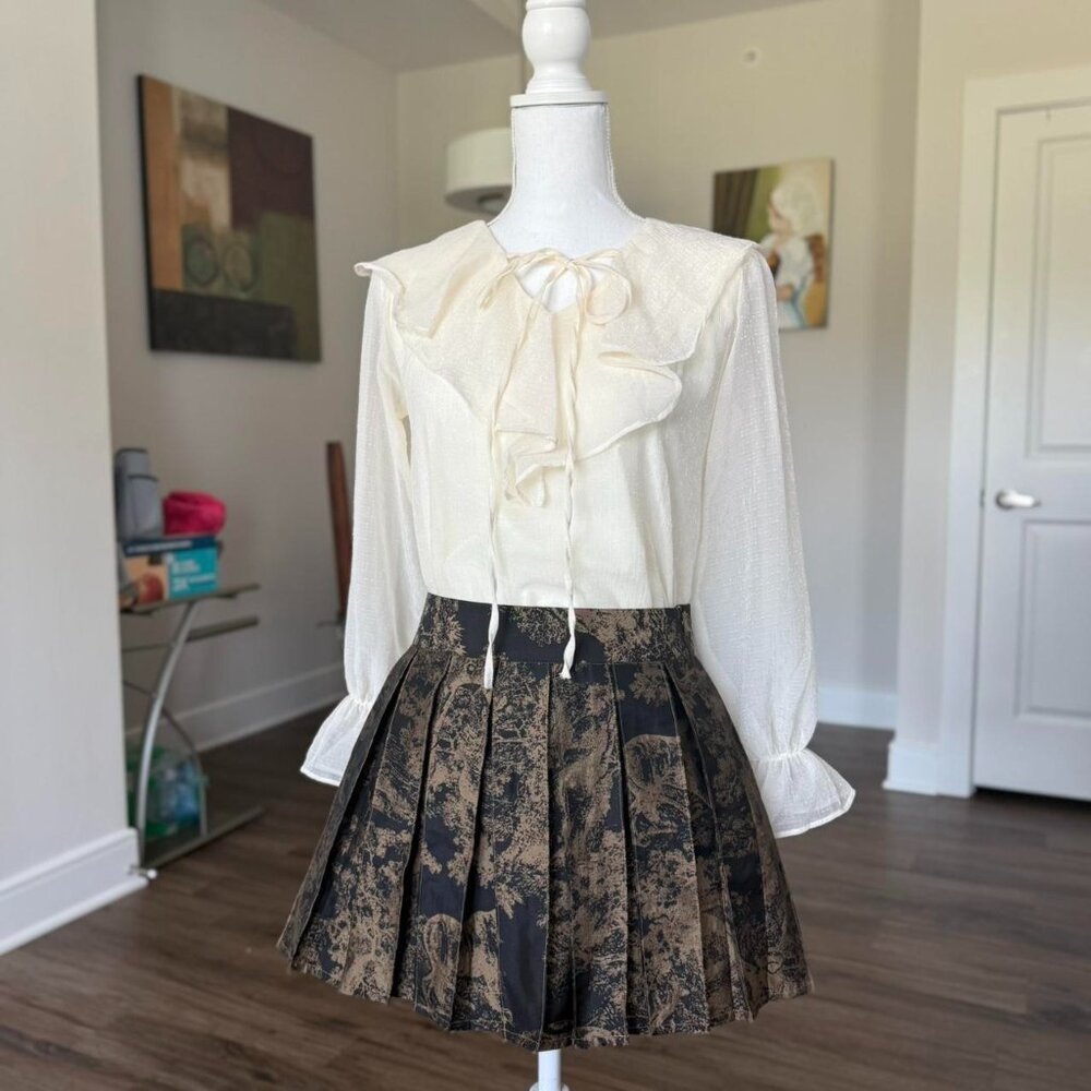 Cream ruffle blouse with tie-front bow